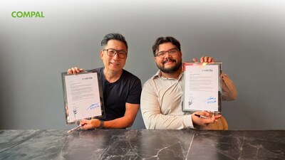 Alan Chang, Vice President of Infrastructure Solutions Business Group at Compal, and Jorge Santos, Chief Operating Officer at Verda, hold framed partnership agreements during a signing ceremony